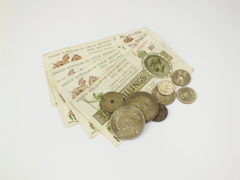 A collection of coins and banknotes
