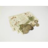 A collection of coins and banknotes