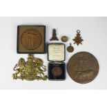 A collection of assorted military and associated medals and badges