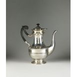 A silver coffee pot