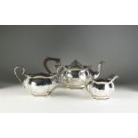 A three piece silver tea service