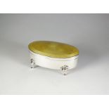 A silver and enamel oval trinket box