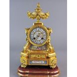A French ormolu and porcelain panel mounted mantel clock, the 3” circular dial painted with three
