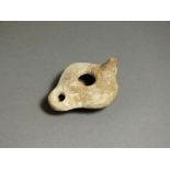Greek ceramic oil lamp, 4th - 1st century BC. Rounded nozzle, oval body with slightly flared