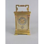 A French gilt brass repeating carriage clock, early 20 th century with 2” circular silvered dial,