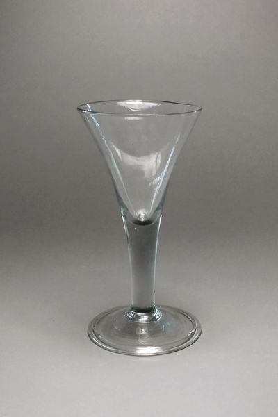 An unusually large George III wine glass with a drawn trumpet bowl above a folded foot, 23.5cm high