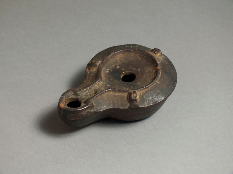 Late Roman, ceramic oil lamp, 4th - 5th century AD. Rounded nozzle with raised channel along spout