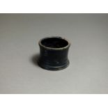 Greek, ceramic black glazed phyxis, 5th century BC; rounded rim, short body with flared base ring.