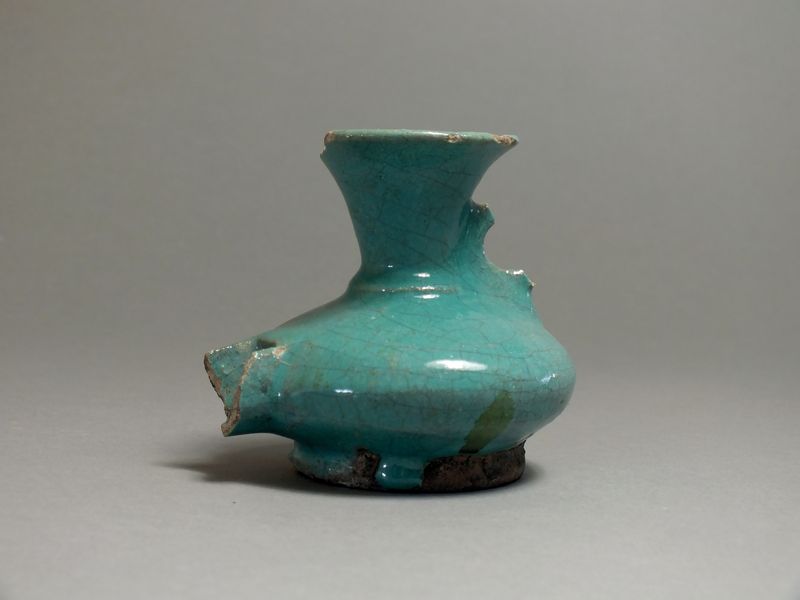Byzantine, ceramic glazed oil lamp, 9th - 10th century AD. Long nozzle with oval sloping body,