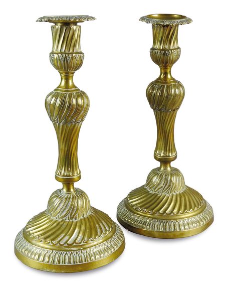 A pair of Louis XVI design wrythen twist gilt bronze candle sticks, 19th century, 28cm high