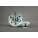 A Worcester porcelain 'Waiting Chinaman' tea bowl and saucer, circa 1770 each with crescent mark