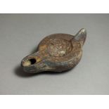 Byzantine, ceramic oil lamp, 6th - 7th century AD. Rounded nozzle, oval body with flat shoulder