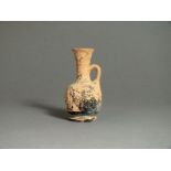 South Italian, Apulian, ceramic black glazed miniature jug, 4th century BC; flat rim with tapering