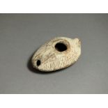 Byzantine, ceramic oil lamp, 5th - 6th century AD. Nozzle forming part of oval body; sloping sides