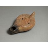 Byzantine, ceramic oil lamp, 6th - 7th century AD. Rounded nozzle, oval body with flat shoulder