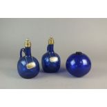 A pair of Bristol blue single-handled decanters and stoppers