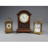 Three early 20th century French timepieces. Two French timepiece carriage clocks and an oak mantel