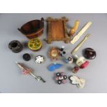 A selection of treen and ivory items to include miniature parasol, small beadwork pin cushions and