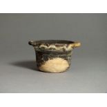 South Italian, Apulian, ceramic black glazed cup, 4th century BC; applied handles to rim, band to