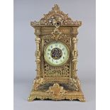 A French cast brass table clock, 19 th century in Chinese taste, the 5” annular dial with Roman
