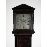 A late 18th-century flame mahogany longcase with associated movement and dial, signed Justin