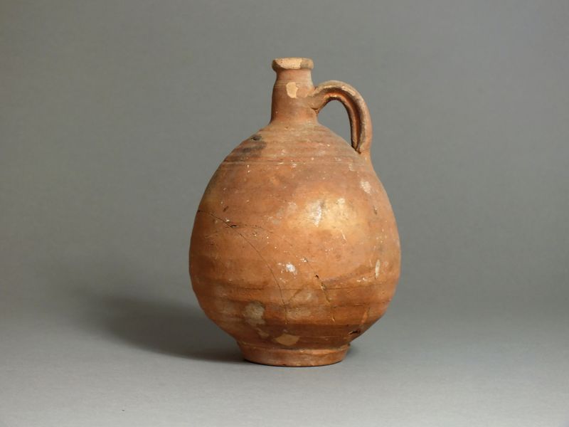 Roman, red ware, North African jug; 1st century AD; small spout with narrow neck, applied strap