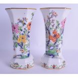 A PAIR OF CARLTONWARE TRUMPED SHAPED VASES printed and painted with birds and flowering rock. 23