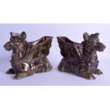 A PAIR OF 19TH CENTURY CONTINENTAL POTTERY PLANTERS in the form of recumbent mythical beasts. 21