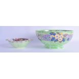 A MALING LUSTRE TWIN HANDLED BOWL together with a larger bowl. 15 cm & 21 cm diameter. (2)