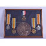 A FRAMED SET OF WW1 MEDALS presented to Pte John Hamilton A & S Highrs. Frame 32 cm wide.