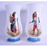 A PAIR OF LATE 19TH CENTURY FRENCH OPALINE GLASS VASES painted figures standing within landscapes.