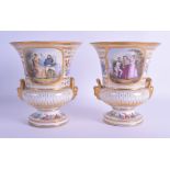 A PAIR OF 19TH CENTURY SEVRES TWIN HANDLED PORCELAIN VASES painted with bands of continuous