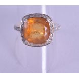 AN 18CT WHITE GOLD DIAMOND AND CITRINE RING. Size S.