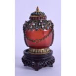 A 19TH CENTURY TIBETAN CARVED AGATE SNUFF BOTTLE AND STOPPER of large proportions, decorated with