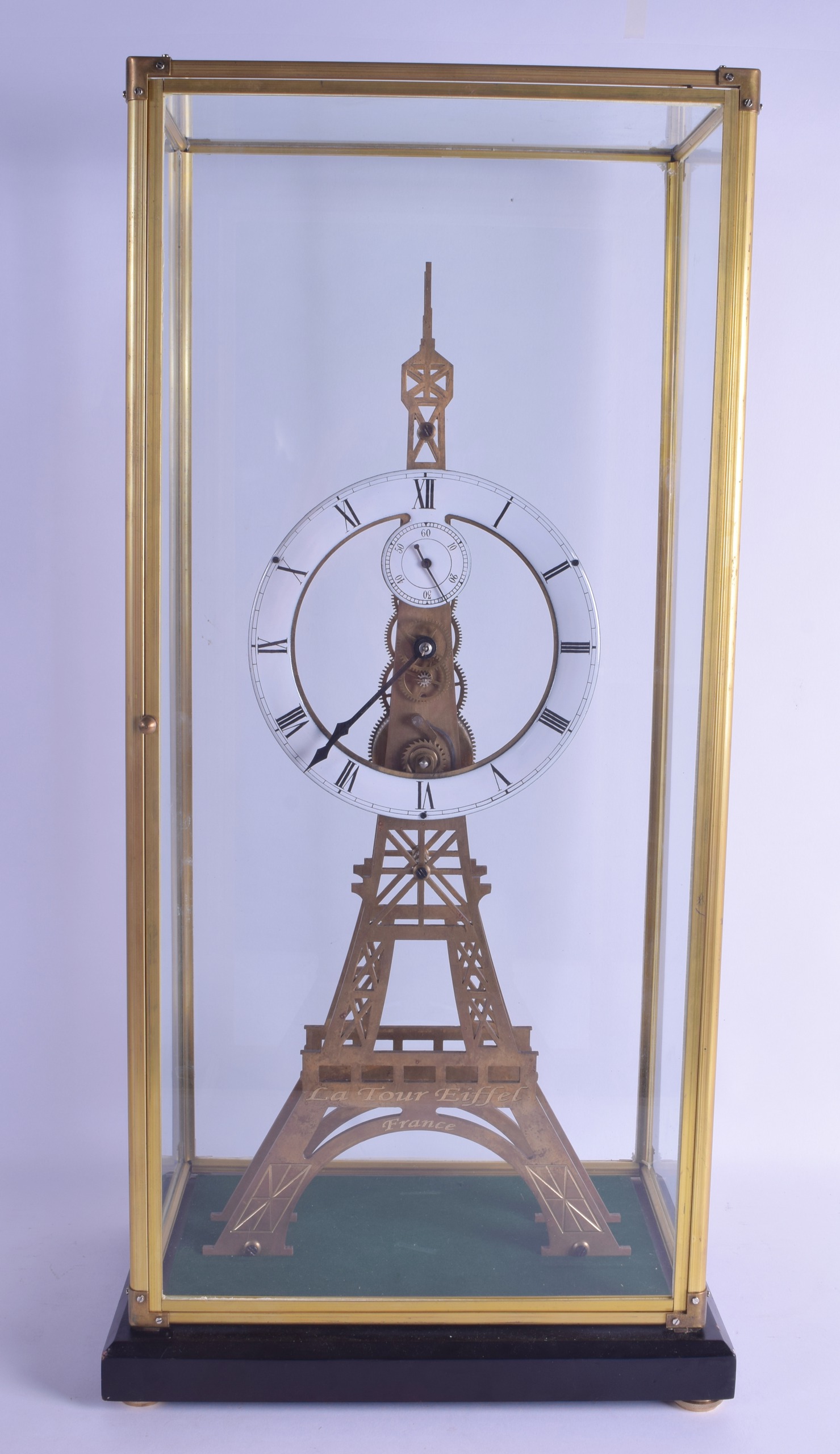 A LARGE CONTEMPORARY BRASS 'LA TOUR EIFFEL' SKELETON CLOCK within a four glass dome. Clock 56 cm x