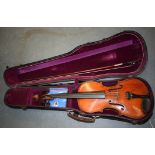 A GOOD ANTIQUE VIOLIN, bearing interior label "Gionvam Paulo Maggini, 1698", together with a bow.