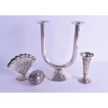 AN ANTIQUE CONTINENTAL SILVER FAN SHAPED VASE together with a stylish candle stick, a white metal