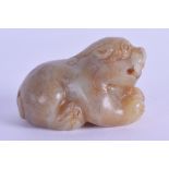 A CHINESE CARVED YELLOWISH GREEN JADE FIGURE OF A RECUMBANT BEAST modelled with its mouth open. 6 cm