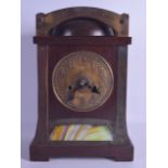 A STYLISH ARTS AND CRAFTS OAK AND BRASS MANTEL CLOCK possibly by Liberty & Co, the front inset