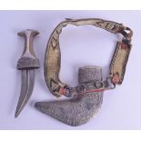 A 19TH CENTURY RHINOCEROS HORN HANDLED OMANI KHANJAR JAMBIYA DAGGER decorated with repousse silver