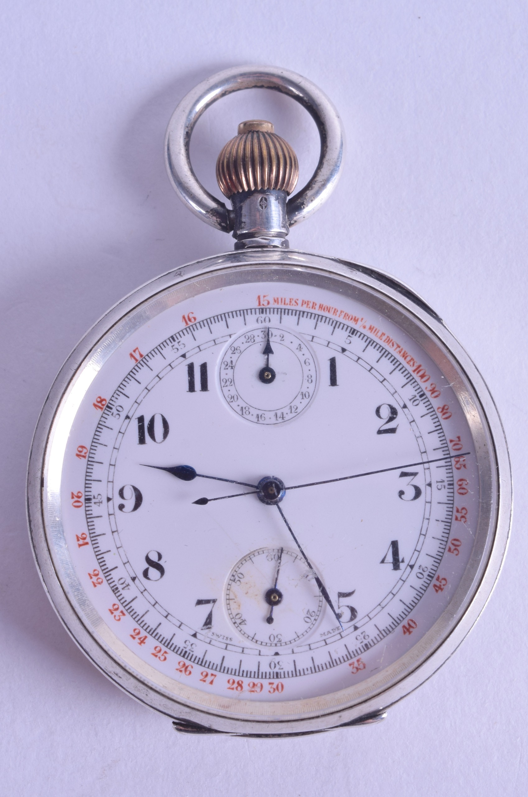 AN ANTIQUE CONTINENTAL SILVER CHONROMETER POCKET WATCH with white enamel dial and black numerals.