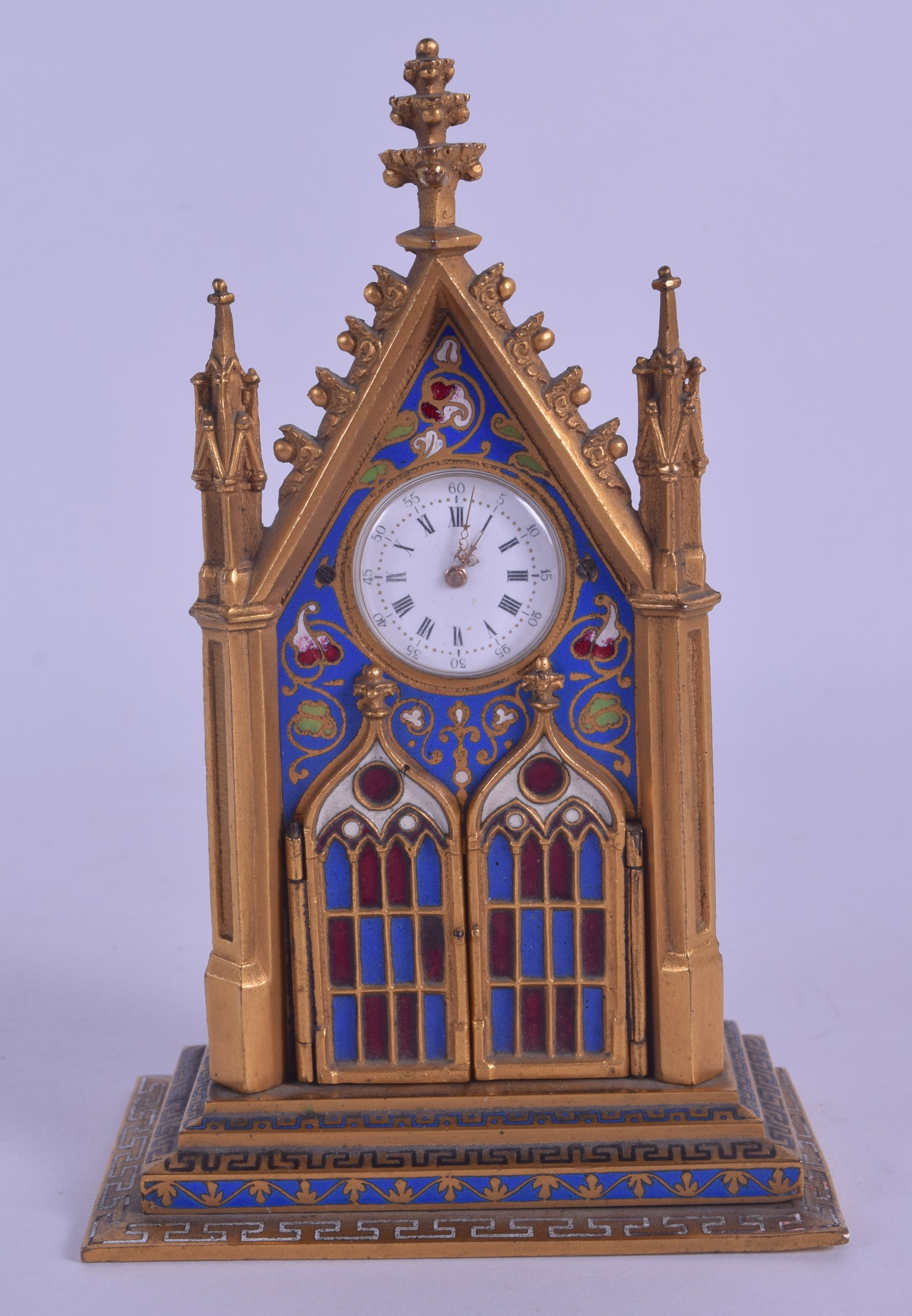 A RARE 19TH CENTURY FRENCH CHAMPLEVE ENAMEL GOTHIC CLOCK the doors opening to reveal two enamelled