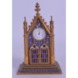 A RARE 19TH CENTURY FRENCH CHAMPLEVE ENAMEL GOTHIC CLOCK the doors opening to reveal two enamelled