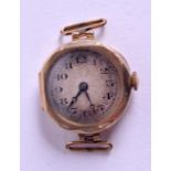 A VINTAGE 9CT GOLD WATCH FACE with movement. 11.6 grams overall. 2.25 cm wide.