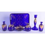A BOHEMIAN BLUE AND GILT GLASS LADIES VANITY TRAY with matching vases, stick, ring tray etc. Tray 24