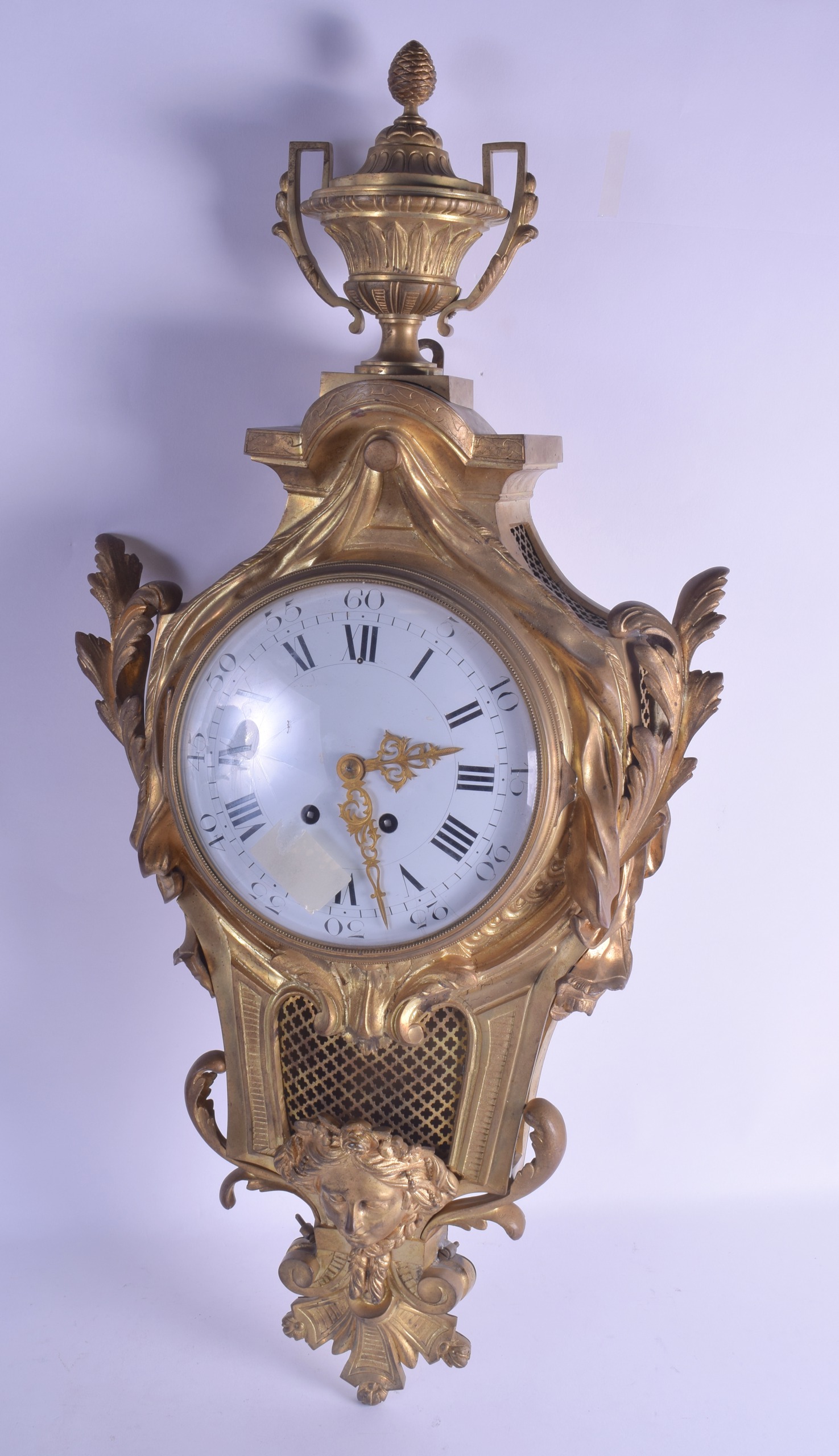 A LARGE 19TH CENTURY FRENCH ORMOLU CARTEL CLOCK with large central mask head, the large white enamel