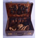 A SUPERB LATE VICTORIAN/EDWARDIAN TRAVELLING LEATHER CASE containing a fully fitted carved