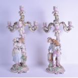 AN UNUSUAL PAIR OF LATE 19TH CENTURY GERMAN PORCELAIN ENCRUSTED FIGURES depicting a boy with a