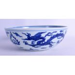 A CHINESE BLUE AND WHITE PORCELAIN DICE BOWL bearing Longqing marks to base, painted with dragons.