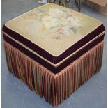 A VINTAGE EMBROIDERED STORAGE FOOT STOOL, containing a large quantity of linen. 52 cm x 60 cm wide.